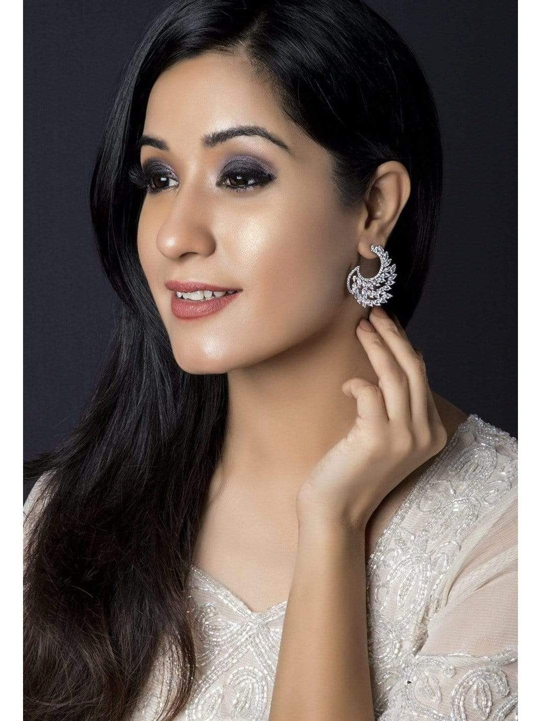 Rhodium Plated White Cubic Zirconia Studded Handcrafted Feather Shaped Statement Stud Earrings